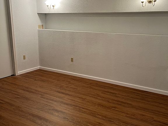 Heated extra room in basement with new flooring