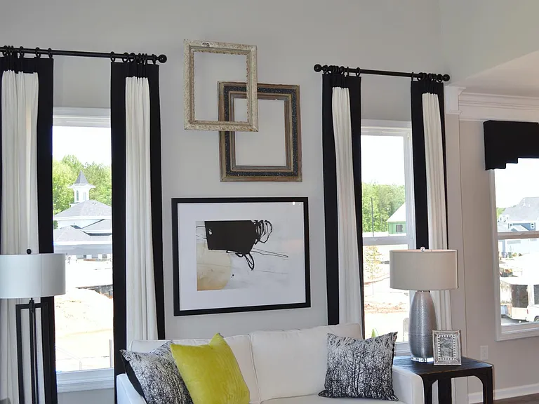 The vaulted ceiling adds a sense of grandeur to the living room.