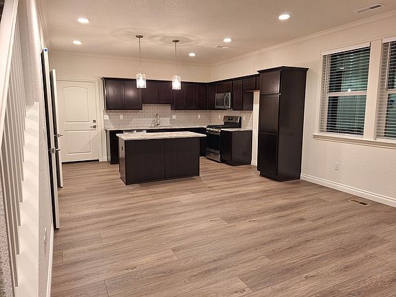 Entrance into kitchen provides a flexible space.
