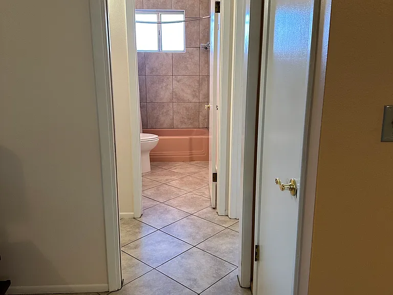 to hallway; pocket door