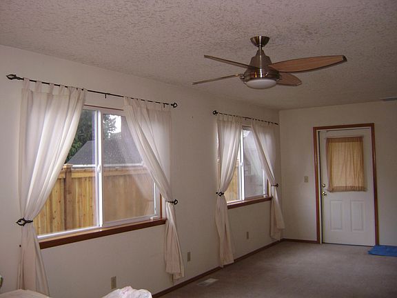 Ceiling fan w remote. The carpet has been removed and replaced with grey plank that you can see in other pictures.