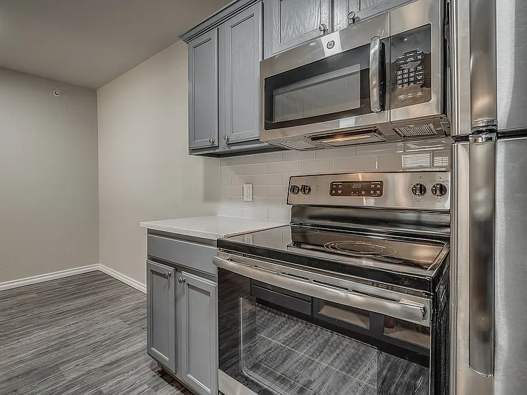 Experience the charm of this contemporary kitchen, complete with sleek appliances and stylish finishes.