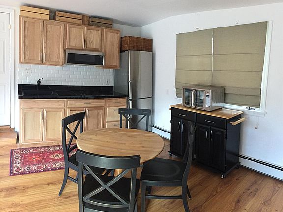 kitchen has two burner convection top built into the granite countertop and XL French door countertop oven, built in microwave and refrigerator.
