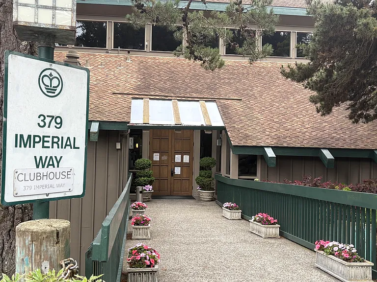 A bridge to the front entrance of the clubhouse featuring the most notable amenities