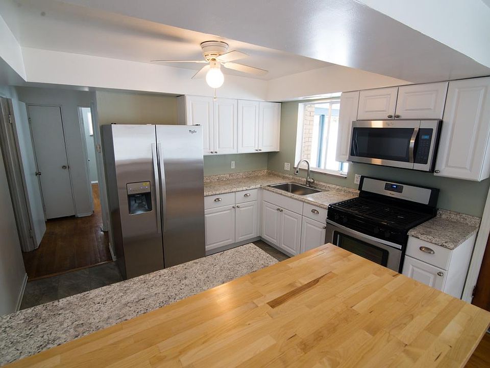 View from breakfast bar into kitchen