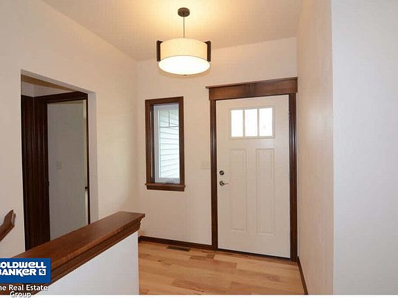 Foyer features bench w/hooks