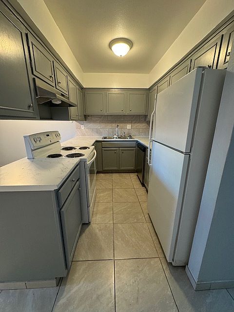 Kitchen includes dishwasher, stove and refrigerator,