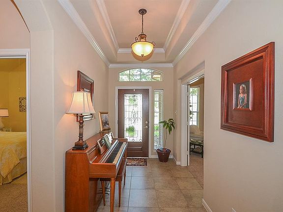 Such a warm and welcoming entryway has natural light and offers a transitional space into the main part of the home.