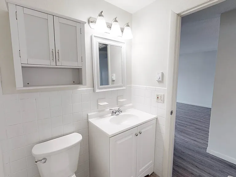newly renovated designer bathroom with sleek hardware