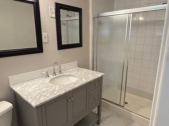 Primary bath with new shower, vanity, and flooring. Just beautiful!