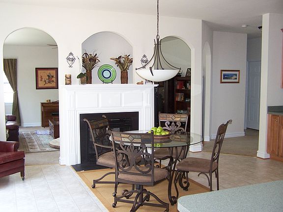 Dramatic arches and firplace in kitchen 