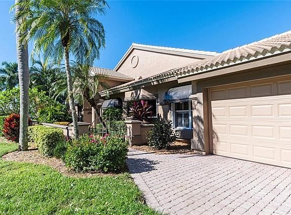 Adorable front entrance thru wrought iron gates