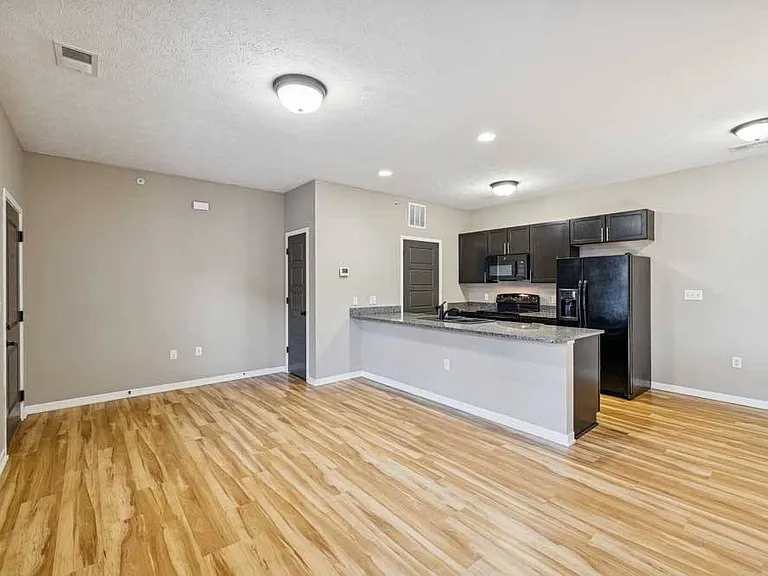 Modern finishes meet functional design in this open-concept kitchen and living space.