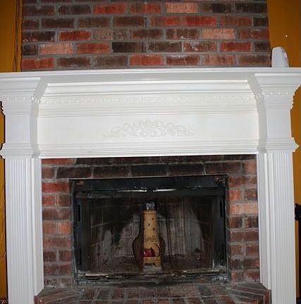 Woodburning fireplace with ornate surround