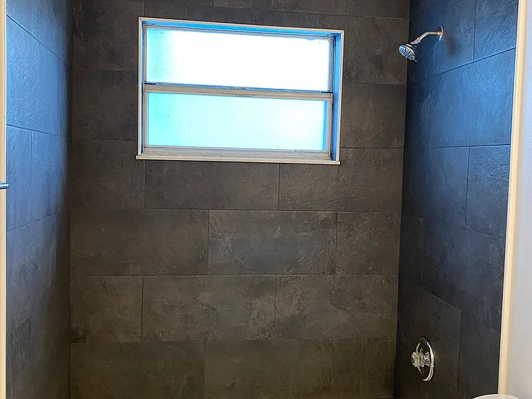 second bathroom with all new bathtub and tiles