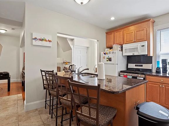 Kitchen looking into living room