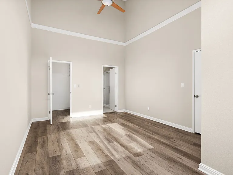 Master/Primary bedroom with vaulted ceiling.