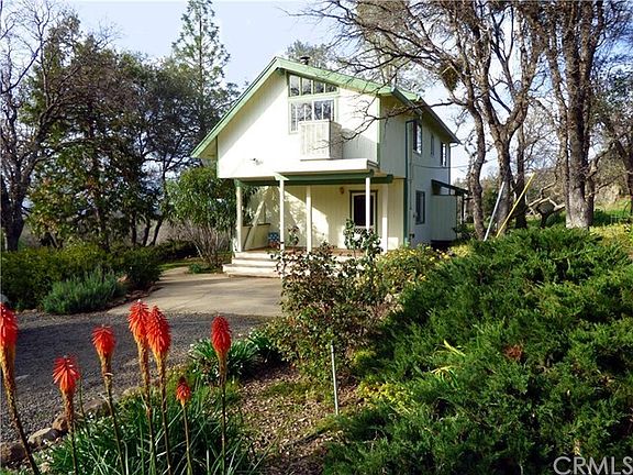 South end of home, door leading into living room.  Covered porch/deck.