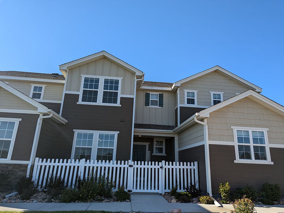 Front of house, including fenced in and gated patio.
