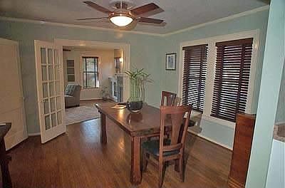 Dining Room With French Doors and Decorative Ceiling Fan