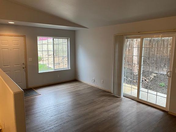 Entry and living room with access to garden patio.