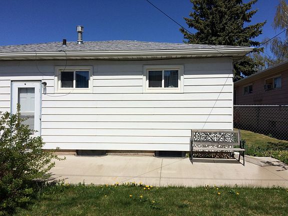 private fenced backyard with sunny patio