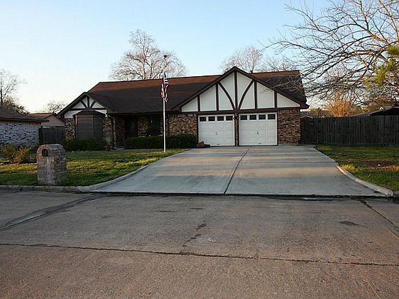 Street view of home and extra wide driveway.