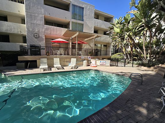 Top floor floor condo oversees the pool!