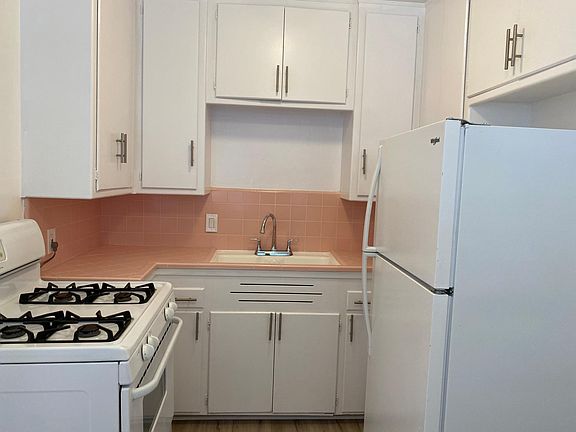 View of kitchen cabinets and great storage.