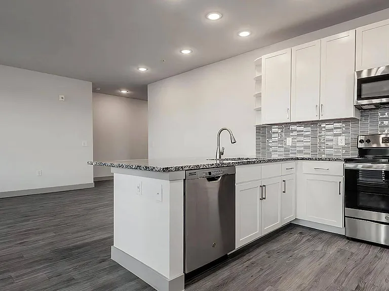 Bright Open-Concept Kitchen with Large Island and Modern Fixtures