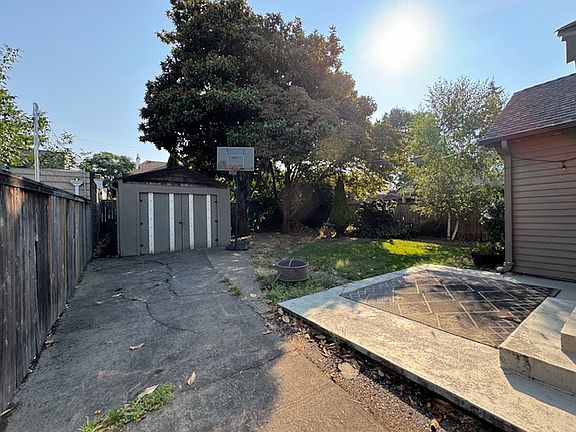 BACKYARD AND DETACHED GARAGE-
LONG DRIVEWAY