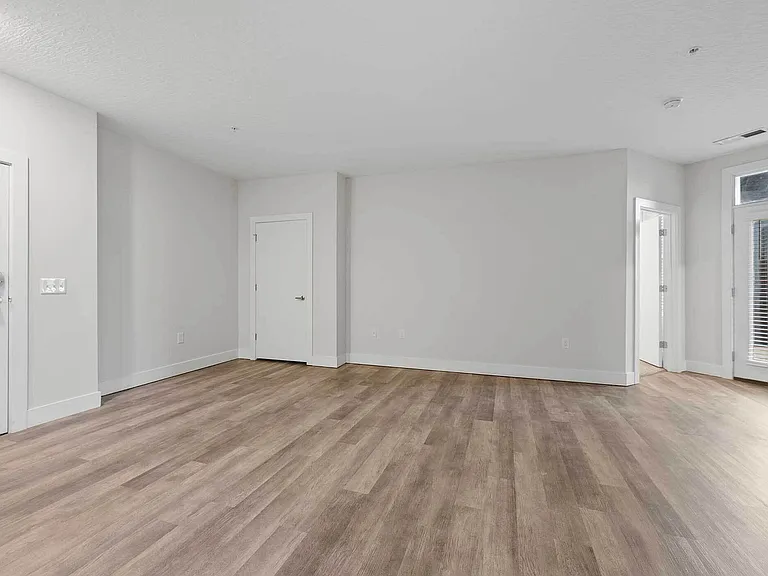 Enjoy abundant natural light and direct access to your private balcony from the spacious living area _ perfect for entertaining or relaxing at The Ave Apartments in Clintonville. Enjoy abundant natural light and direct access to your private balcony from 