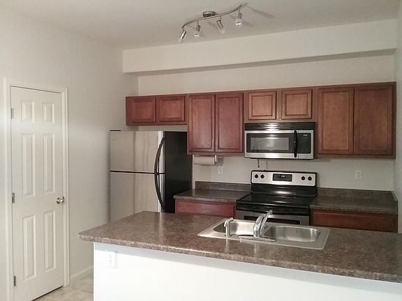 Spacious kitchen with pantry and stainless steel appliances
