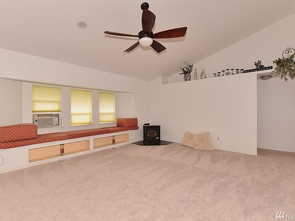 Cozy window seat new gas free standing fireplace, looking towards the guest bedroom wing