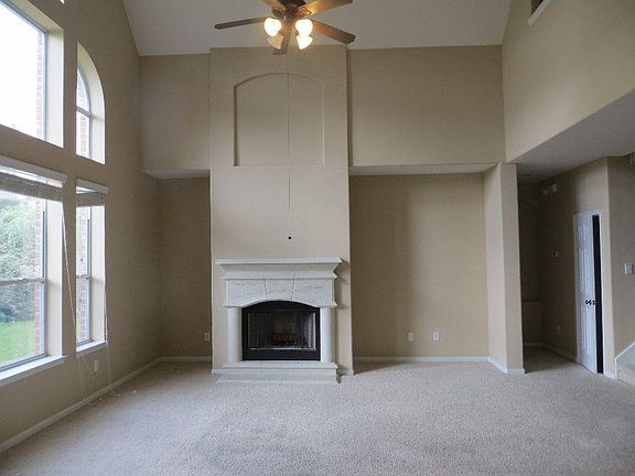 Ceiling fan and cozy fireplace