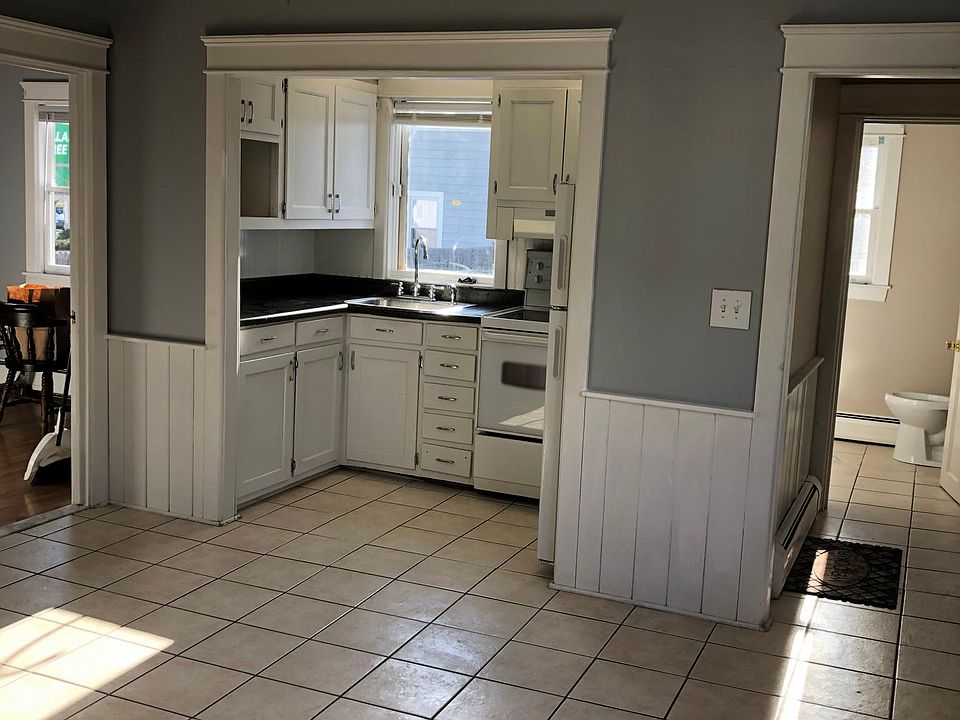 Kitchen and dining room. Bedroom 2 in left frame.
