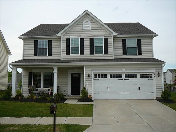 Front View 1 : Landscaped with a variety of blooming perennials