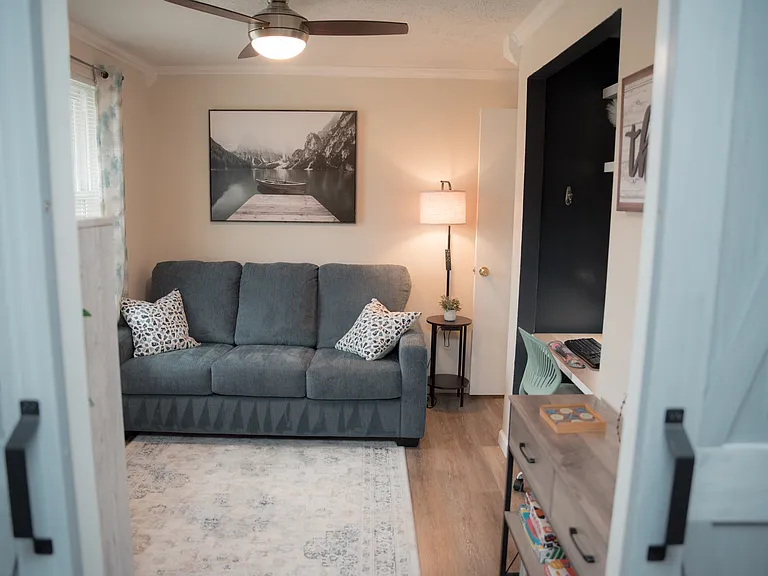 A versatile flex space featuring a comfortable sofa that easily converts into a bed for extra guests.