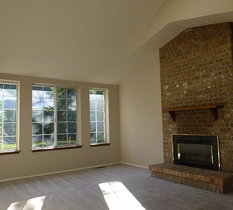 Formal living & dining room looks out to front private court