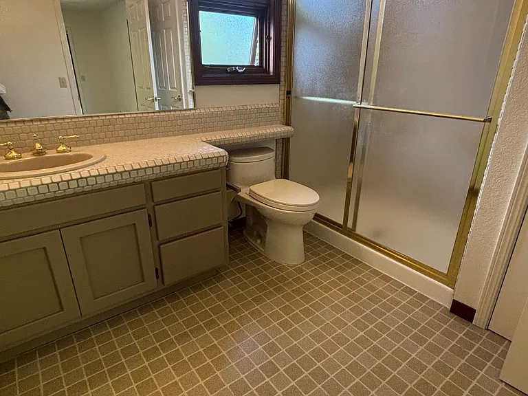 Primary en-suite bathroom, with linen closet and area large enough for vanity set