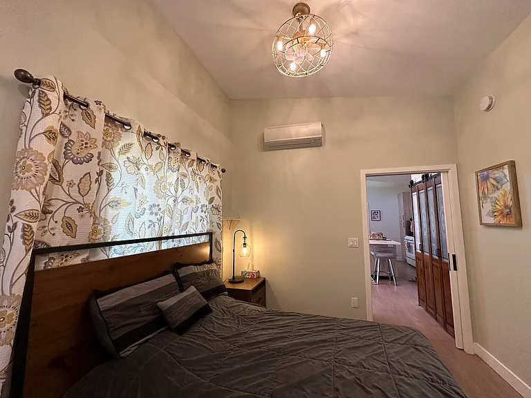 Bedroom #1 has its own ceiling fan and Euro-style wall-mounted heater/AC