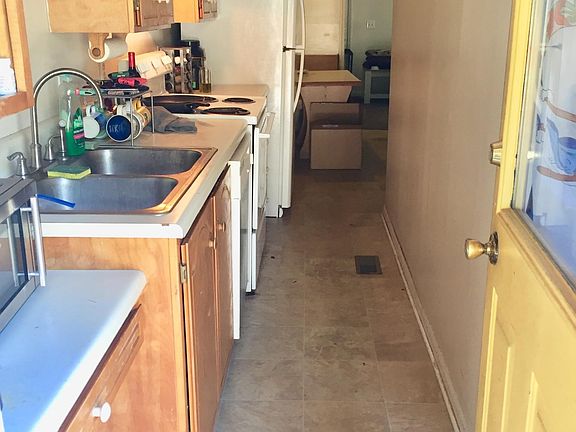 First bedroom is on the right as you enter. The second is also on the right, across from the refrigerator.