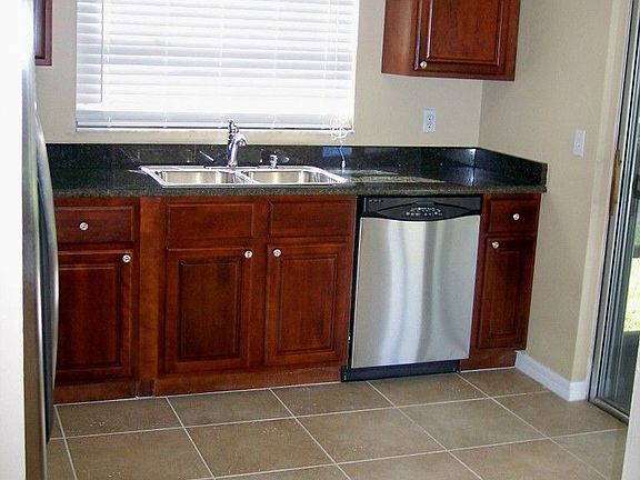 All new Cherry cabinets, new tile