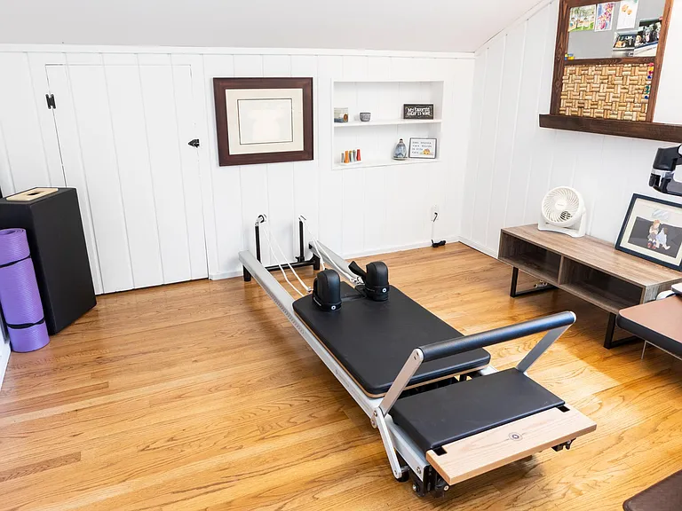 Half-level office space. Pilates machine.