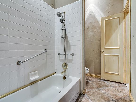 Bathroom with tub and shower.