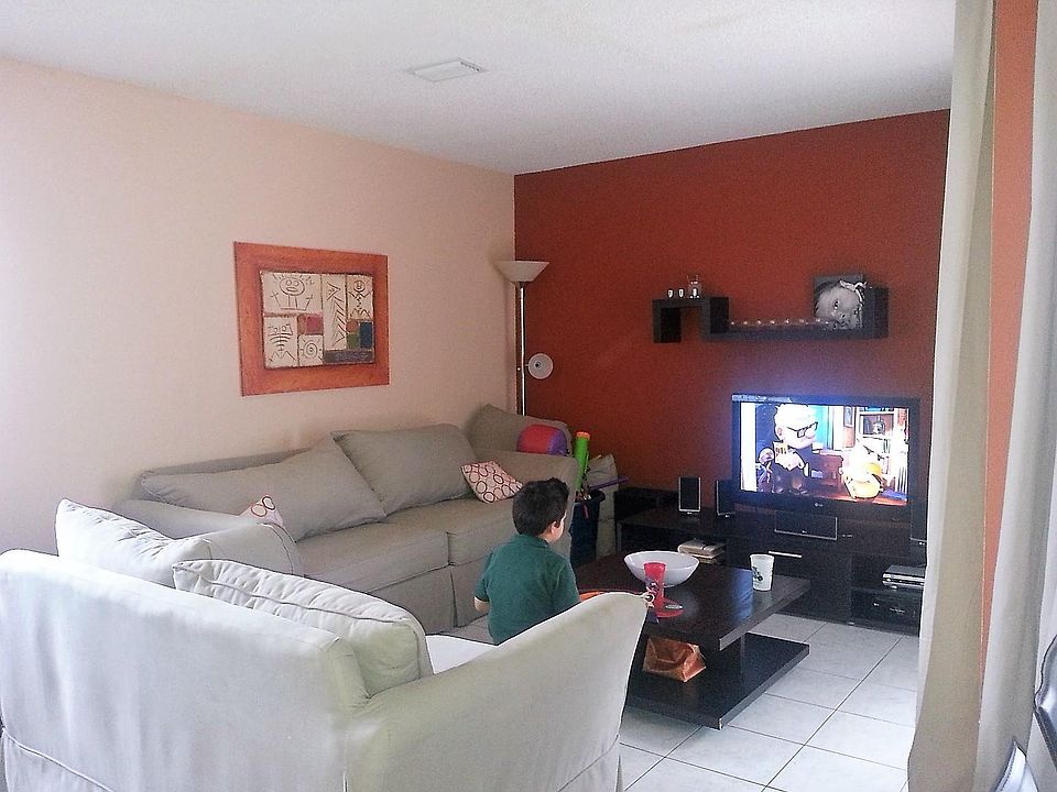 rust wall in living room is now light beige