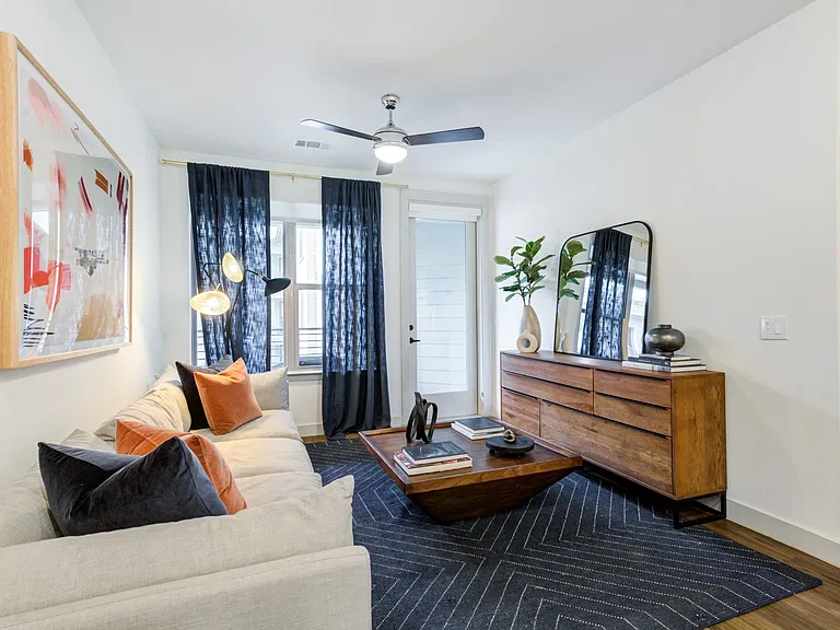 Comfortable Living Room With Wood Coffee Table and Accent Pillows
