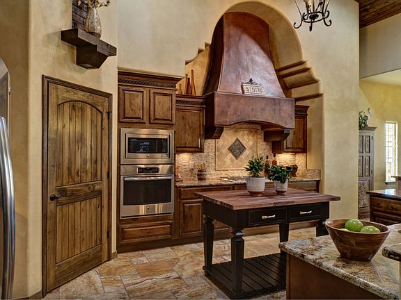 large-walk-in pantry. built-in appliance package. Butcher Block Island.