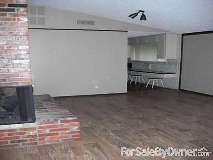 Dining Room : Three sided fire place looking into living room. New patio doors to back porch