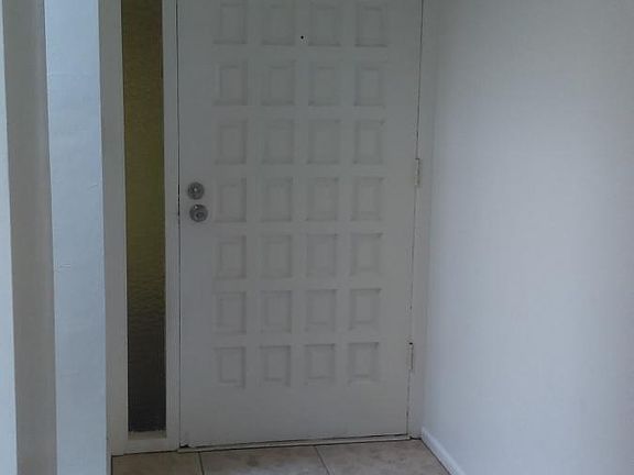 Looking at Front Door From Inside of Home